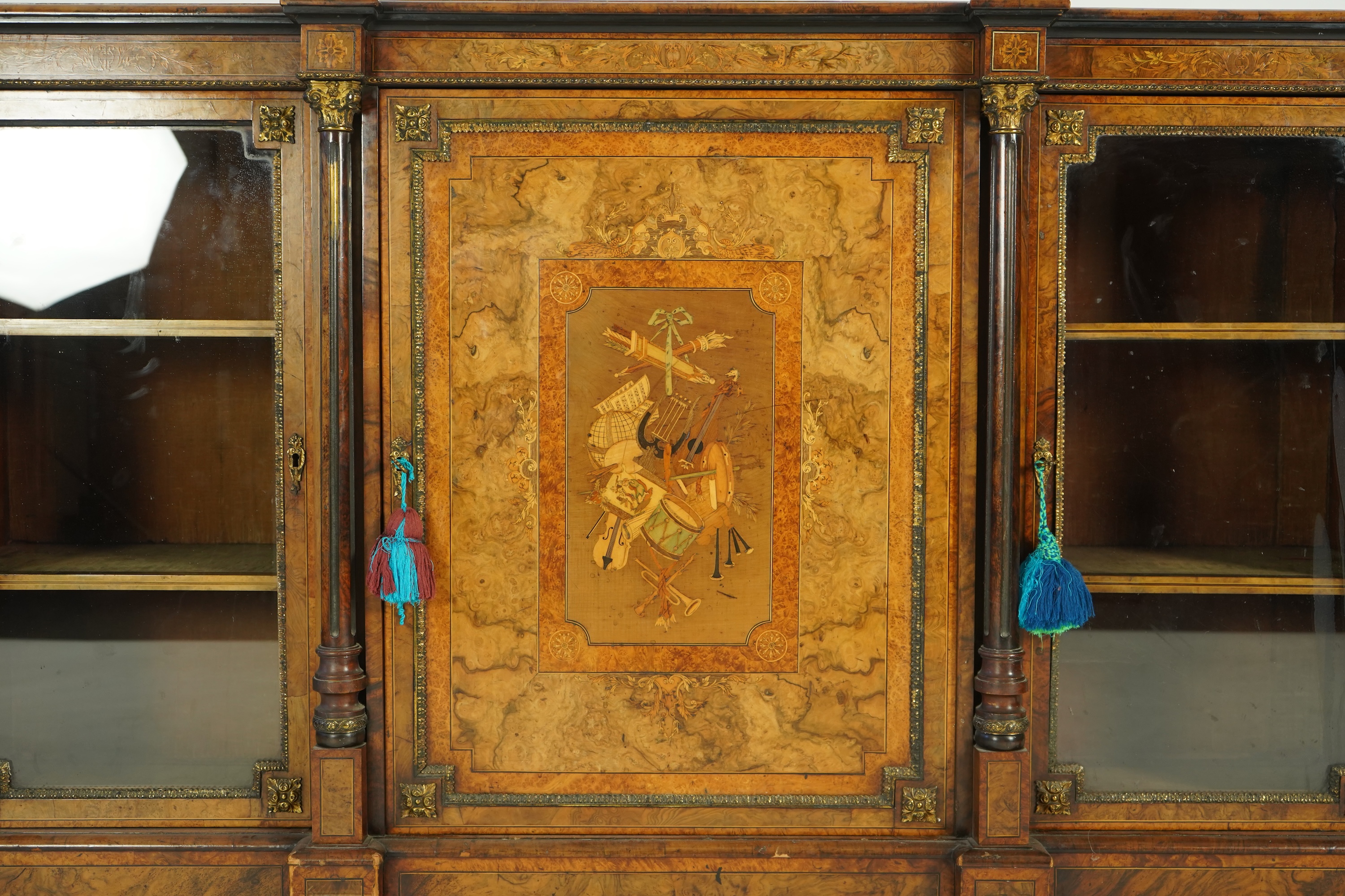 A Victorian birds eye maple banded, gilt metal mounted figured walnut side cabinet